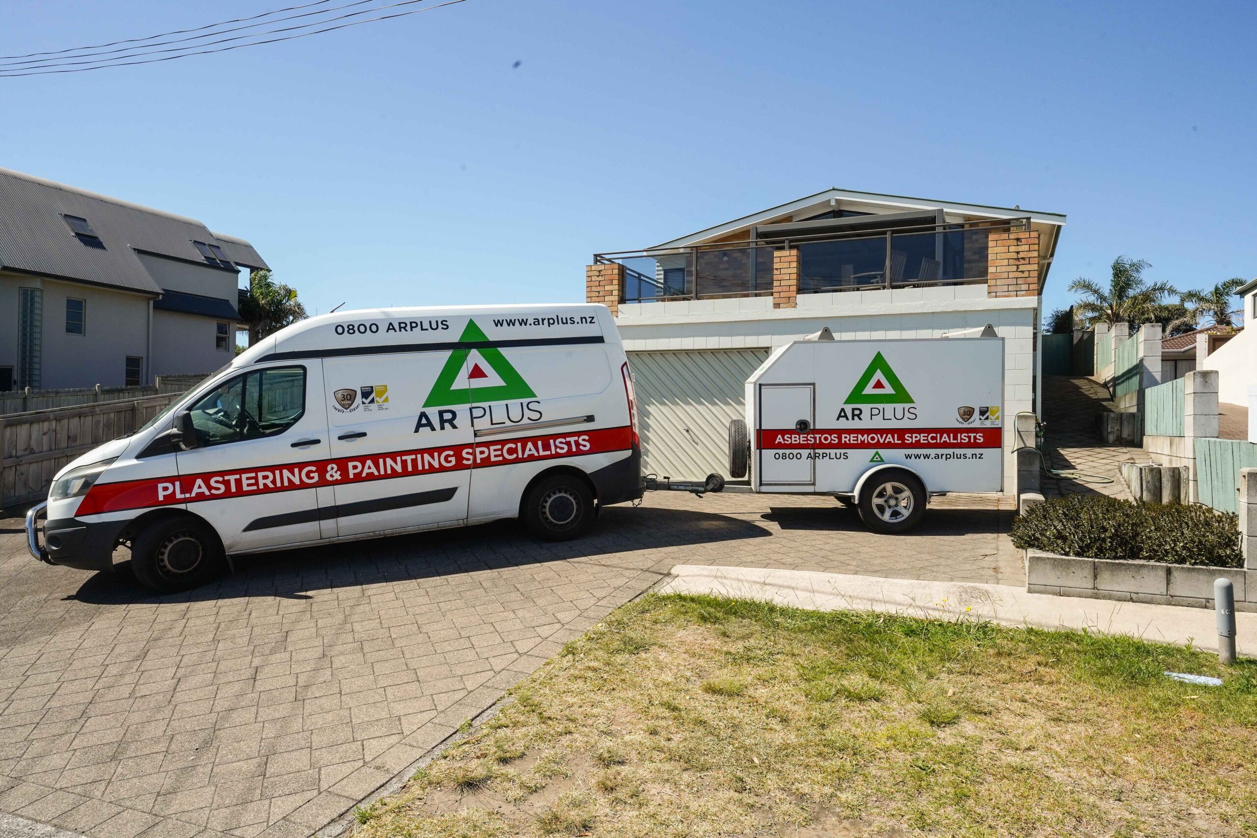 AR Plus plastering and painting vehicle parked outside Pitau Road property in Tauranga