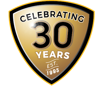 A gold and black logo signifying 30 years in business.